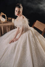 Luxurious Off-the-Shoulder Ball Gown Sweetheart Neckline Feather Trim Beaded Lace Wedding Dress with Glitter Train E-306
