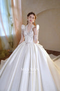 Opulent Ivory V-Neck Satin Ball Gown with Crystal Embroidery, Sheer Sleeves & Keyhole Back Bow A001