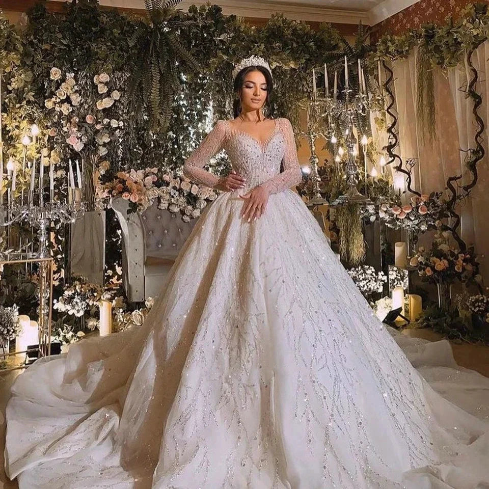 Luxury Ball Gown Illusion Long Sleeves Wedding Dresses 2023 Scoop Neck Glitter Sequined Beading Bride Gowns Vestidos De Noiva