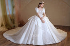 Regal Ivory Square-Neck Satin Ball Gown with Puff Sleeves, Pearl Embroidery & Oversized Bow Train m011