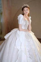 Regal Ivory Square-Neck Satin Ball Gown with Puff Sleeves, Pearl Embroidery & Oversized Bow Train m011
